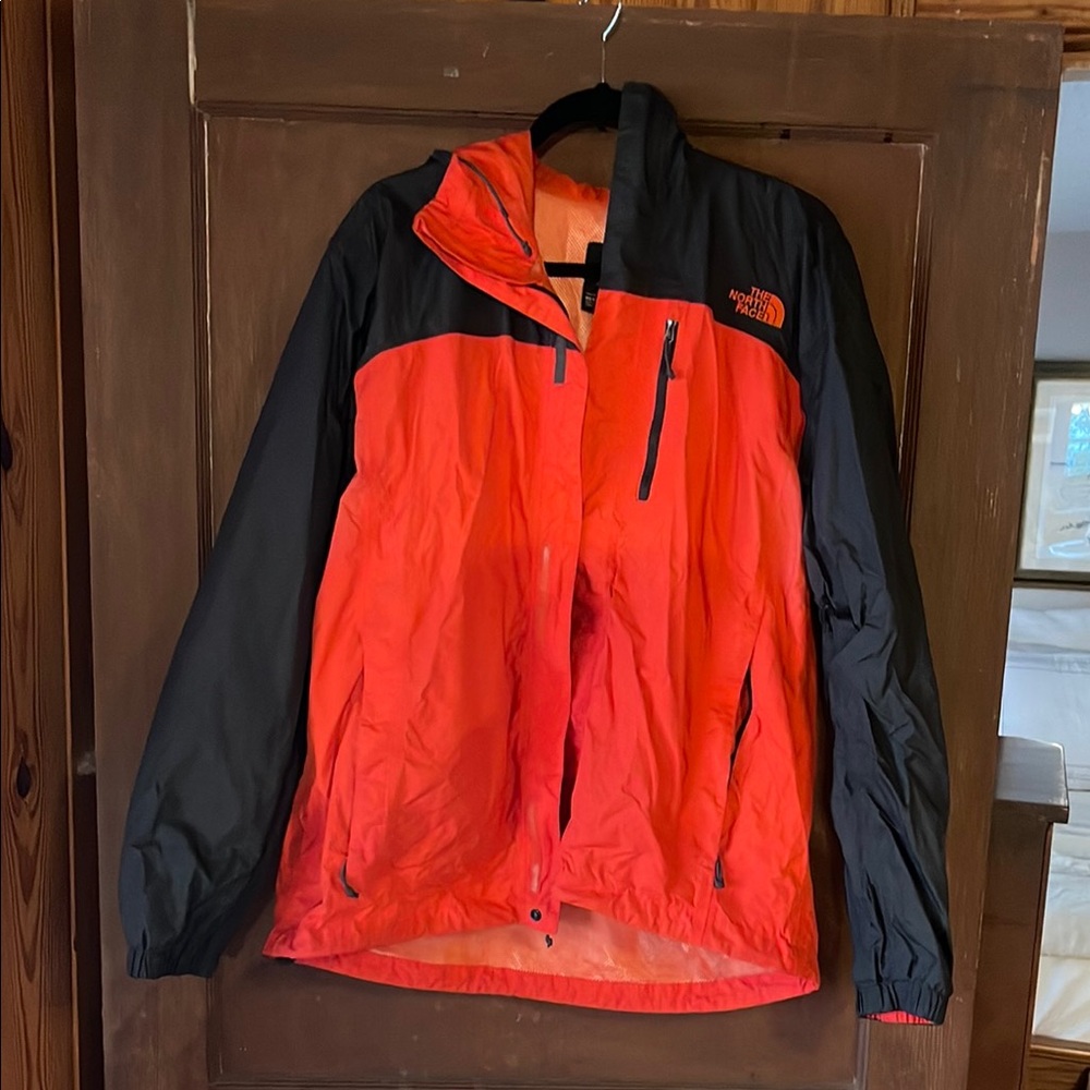 The North Face Red and Black Raincoat for Outdoor Activities